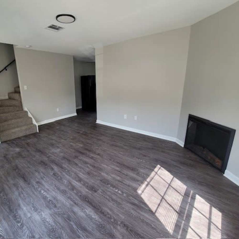Unfurnished living room with fireplace at Stonebridge Manor Apartments in Gretna, Louisiana