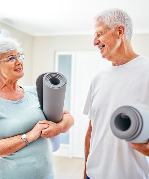 Residents with matts in the fitness center at The Springs at Lake Oswego in Lake Oswego, Oregon