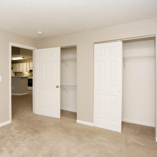 Apartment bedroom with walk-in closets at Spring Lake Apartments in Granger, Indiana