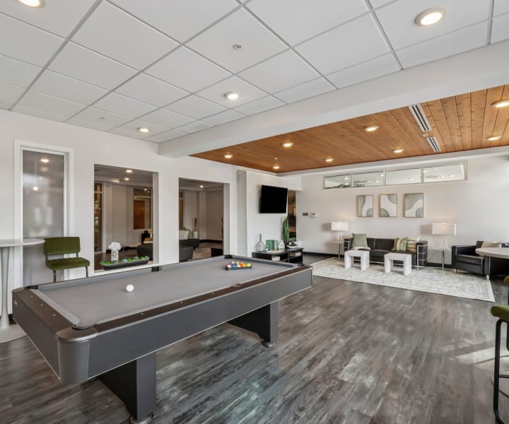 Community clubhouse with pool table and lounge area at Terraces at Manchester in Richmond, Virginia