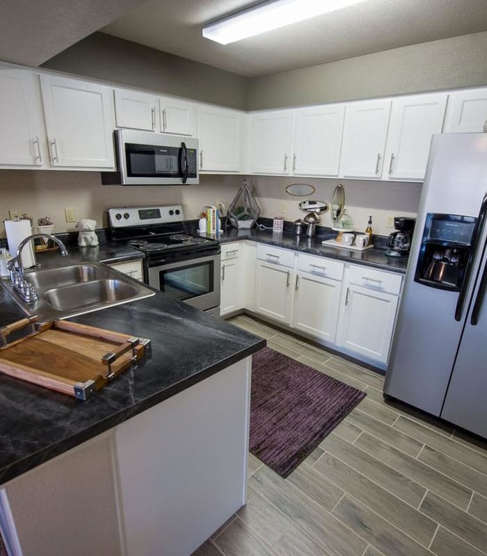 Kitchen with granite countertops at Watercress Apartments in Maize, Kansas