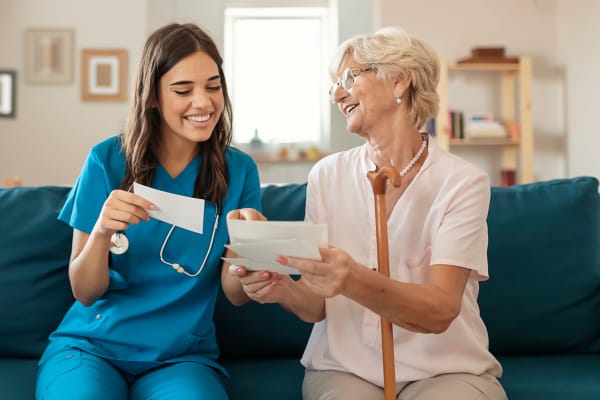 Staff reviews care plan with resident First & Main of New Albany in New Albany, Ohio