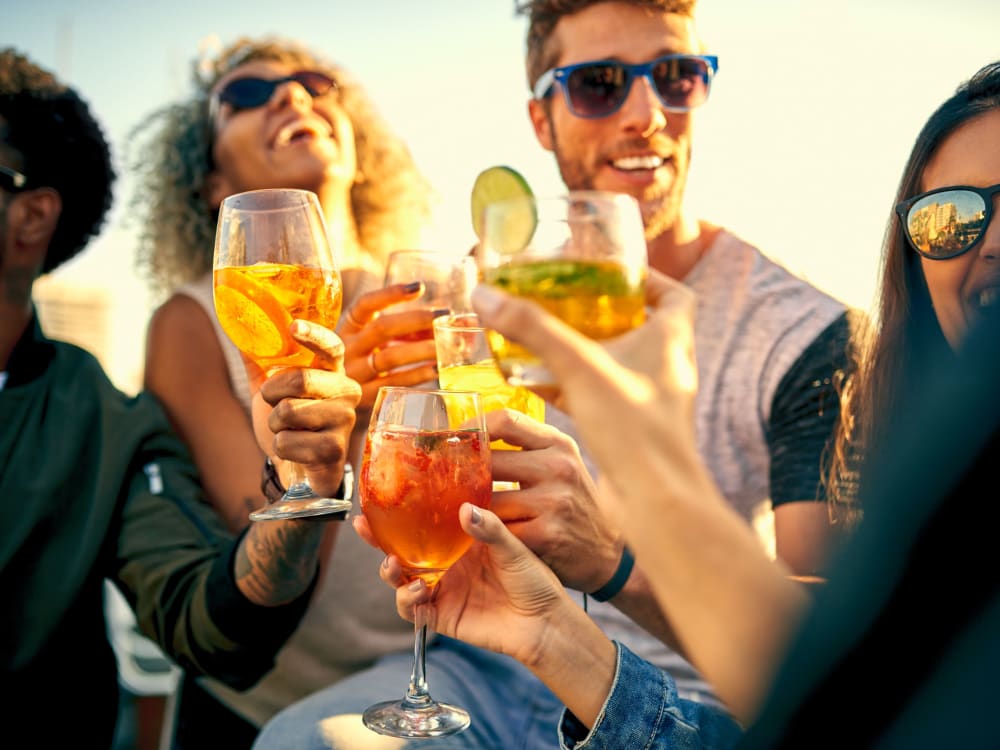 Friends having drinks on a sunny day at Banyan on Washington in Phoenix, Arizona