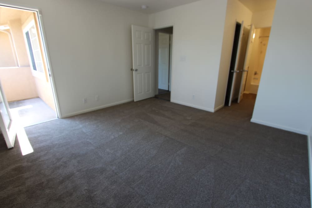 the master bedroom with door to patio at Mira Mesa Ridge in San Diego, California