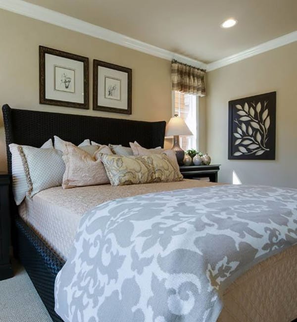 Bed with night stand at Brightwater Senior Living of Highland in Highland