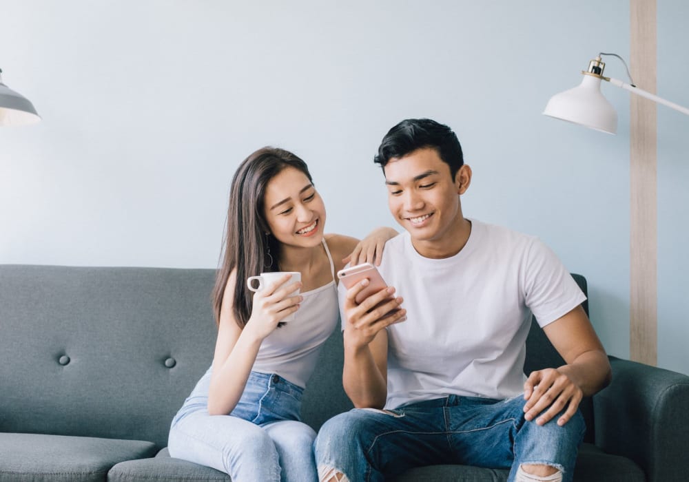 Residents checking their phone at Skyline Redmond in Redmond, Washington