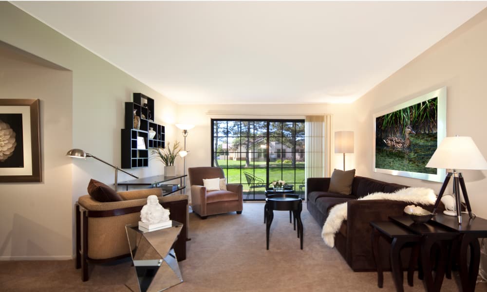 Enjoy a naturally well-lit living room at Muirwood in Farmington Hills, Michigan