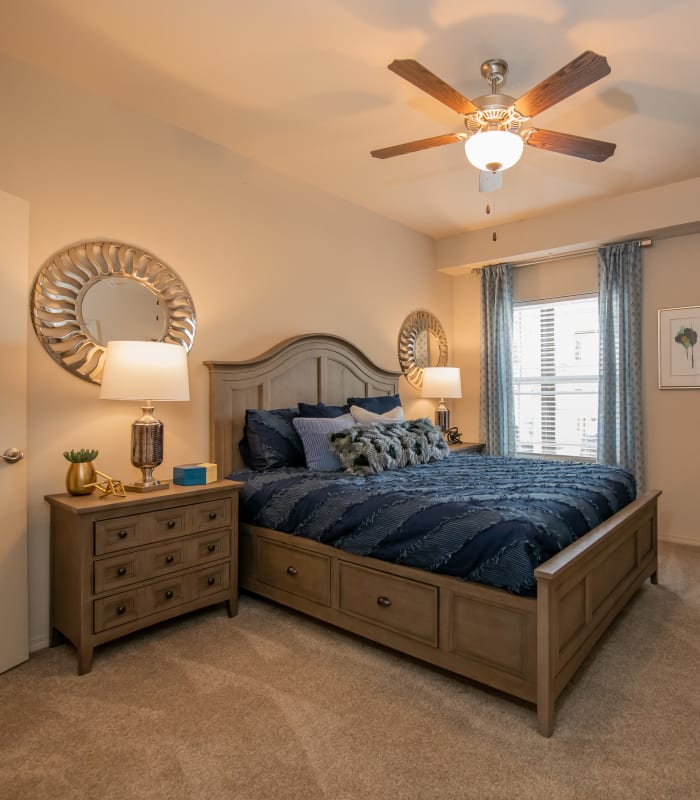 Spacious carpeted bedroom at Bend at New Road Apartments in Waco, Texas