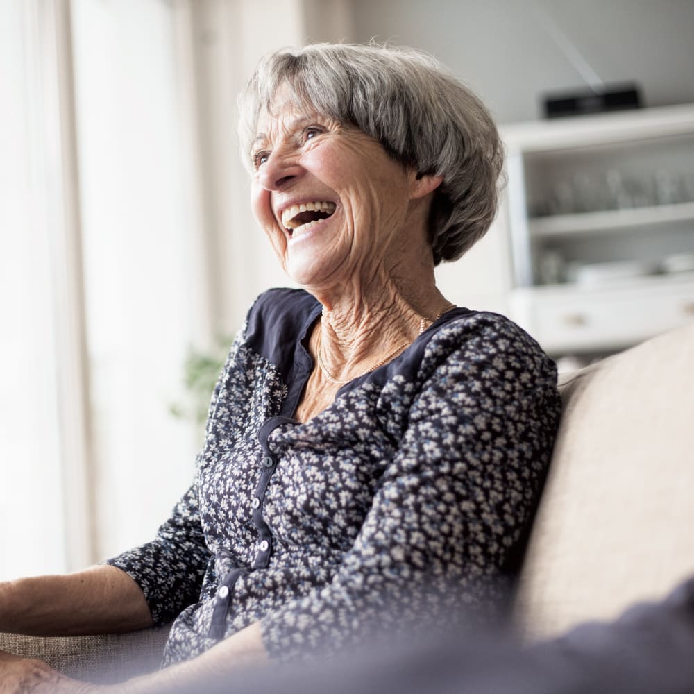 woman sitting and laughing at Anthology Senior Living in Chicago, Illinois