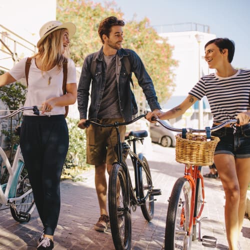 Residents walking their bikes near Social 28 in Gainesville, Florida