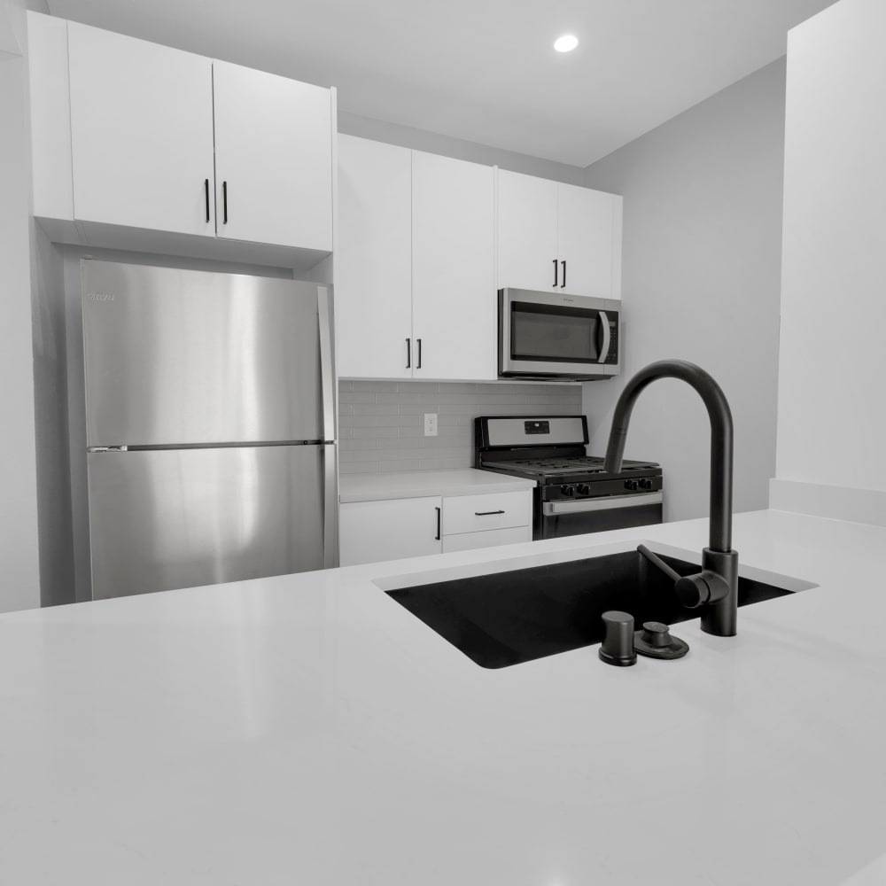 Modern kitchen with stainless-steel appliances at The Tower at Hollywood Hills, Los Angeles, California