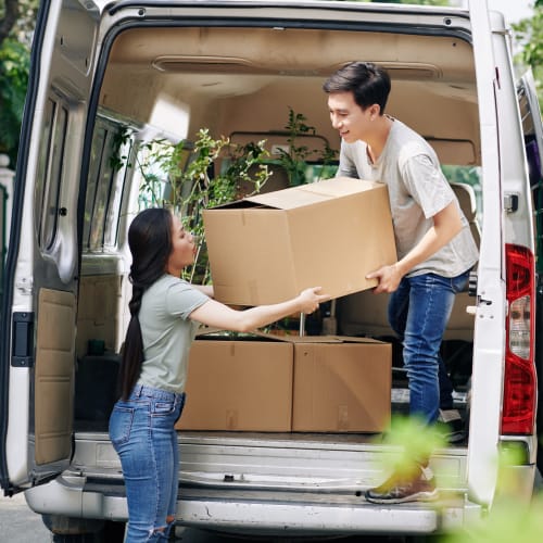 A couple loading a van with boxes to be stored at Red Dot Storage in Stapleton, Alabama