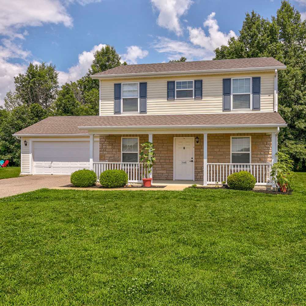 Two-story house with green lawn at Orchard Glen in Orrville, Ohio