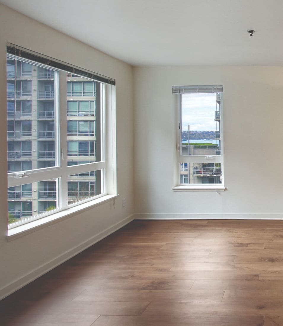 Open-concept layout with hardwood flooring in a model home at 2900 on First Apartments in Seattle, Washington