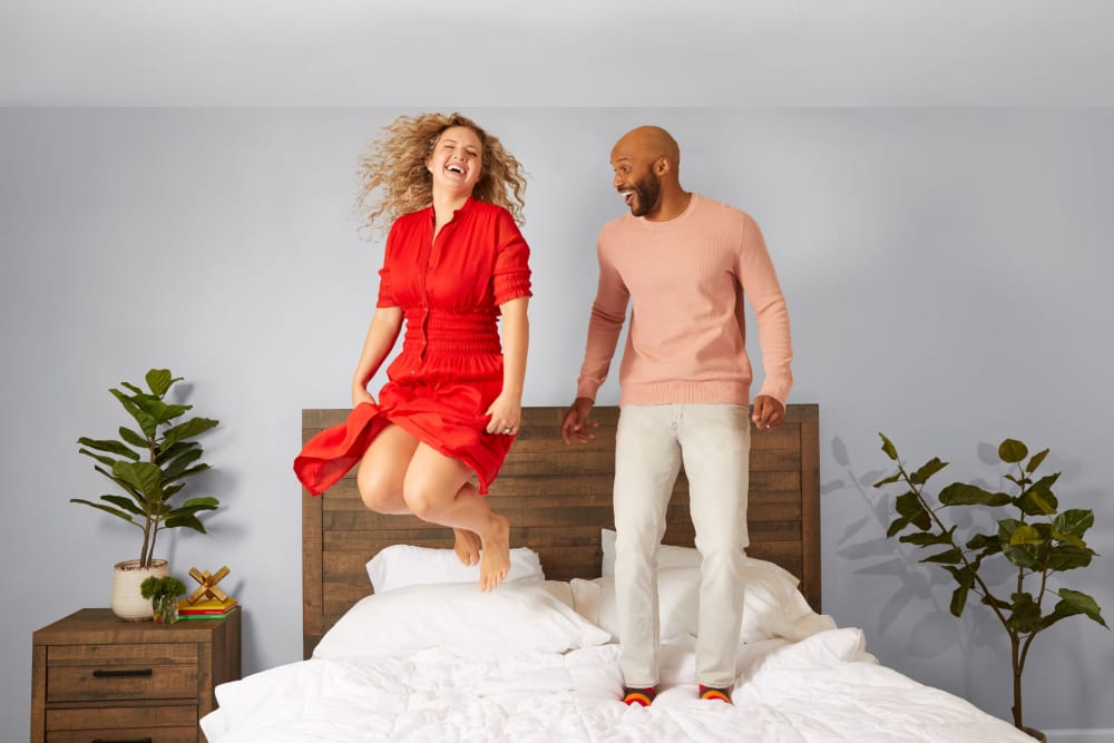 Two residents jumping on their bed at BB Living at Union Park in Phoenix, Arizona