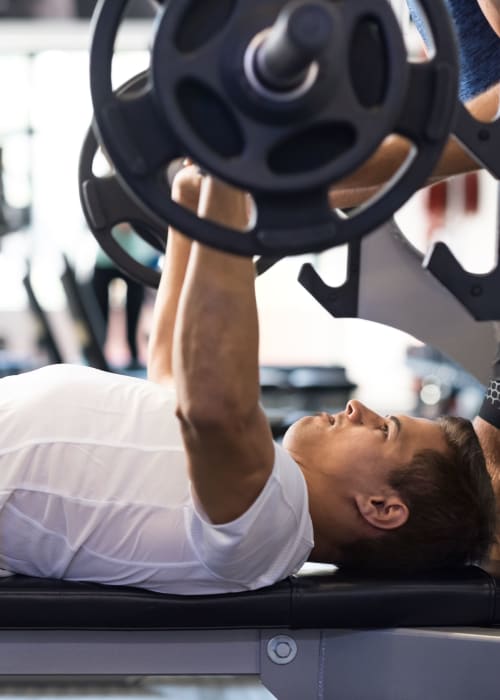 Resident lifting weights at RISE on Chauncey in West Lafayette, Indiana