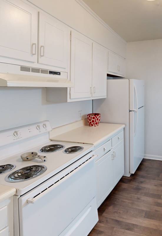 Bright kitchen with white appliances at Sedgefield in Florence, South Carolina