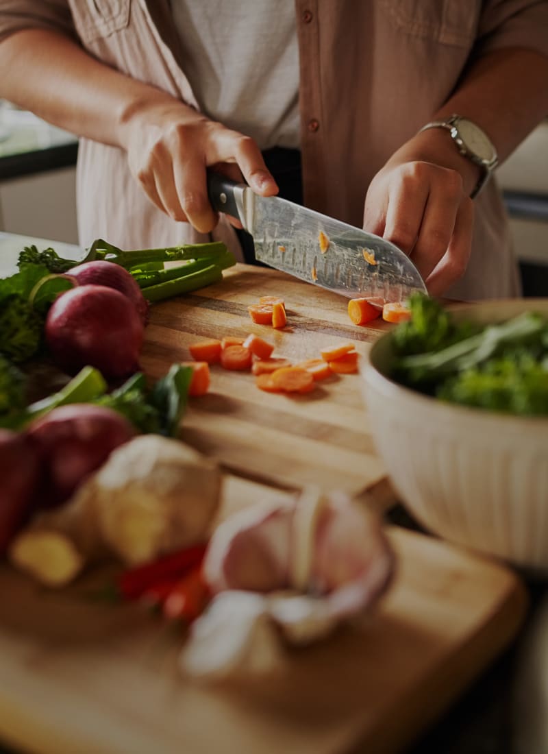Resident cooking at Marquis at Town Centre in Broomfield, Colorado
