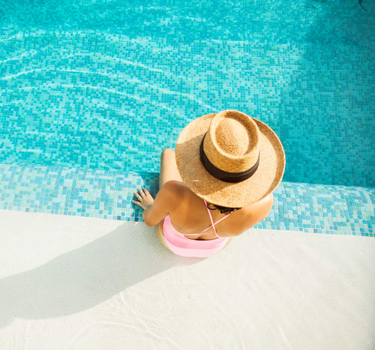 Resident relaxing poolside at The Marc, Palo Alto in Palo Alto, California