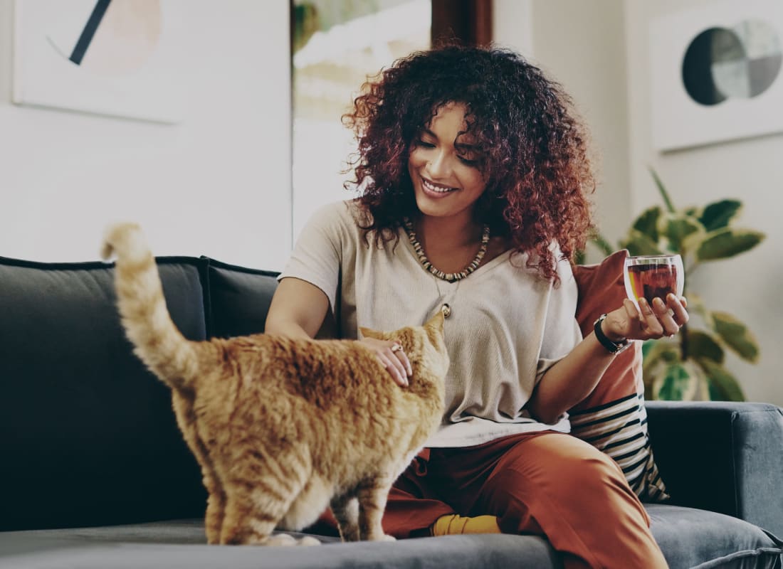 Resident with her cat at The Abbey at Energy Corridor in Houston, Texas