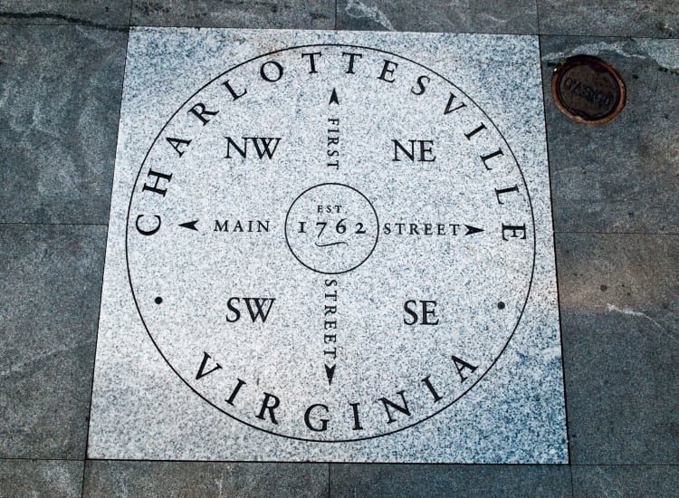 Directional stone on the pedestrian mall downtown near North Woods in Charlottesville, Virginia