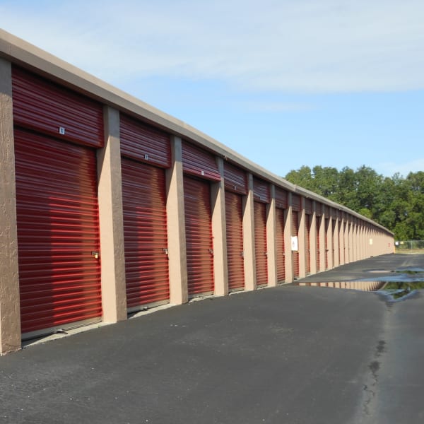 Outdoor storage units with red doors at StorQuest Self Storage in Sarasota, Florida