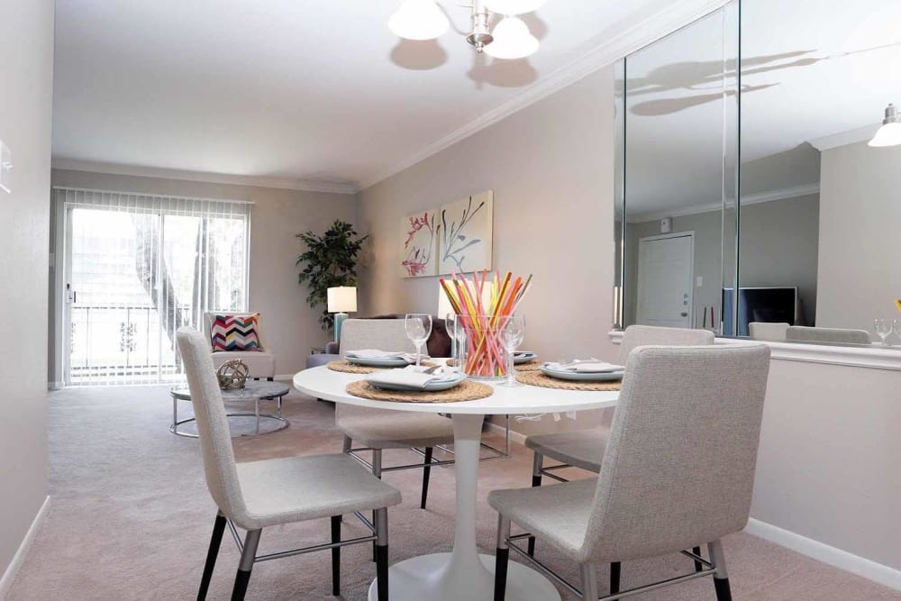 A unique dining area set for four at Brittany Place Apartments in Houston, Texas