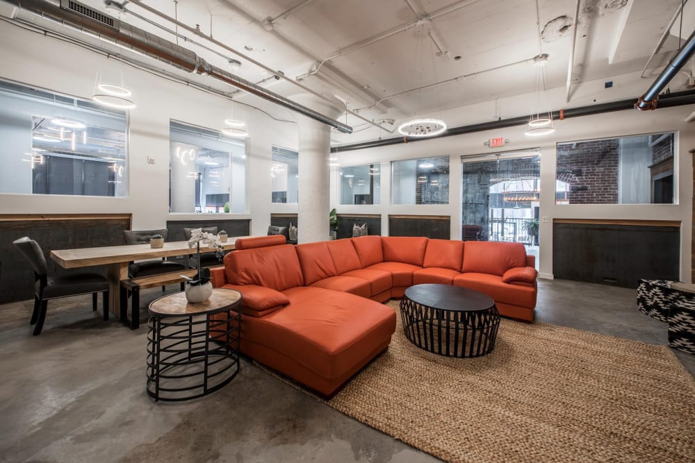 Red couch in comon area at Brush Factory Lofts in Philadelphia, Pennsylvania
