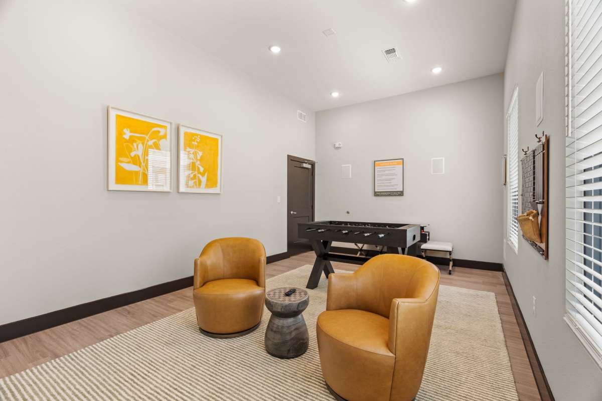 Resident lounge with foosball table at Walnut Springs in Seguin, Texas