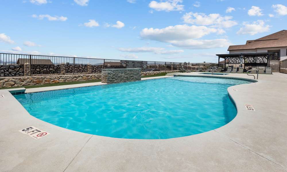 Swimming pool with lounge seating at Retreat at Horizon Hills in El Paso, Texas