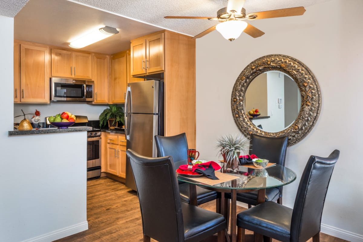 A dining area and kitchen in an apartment at River Ranch, Simi Valley, California