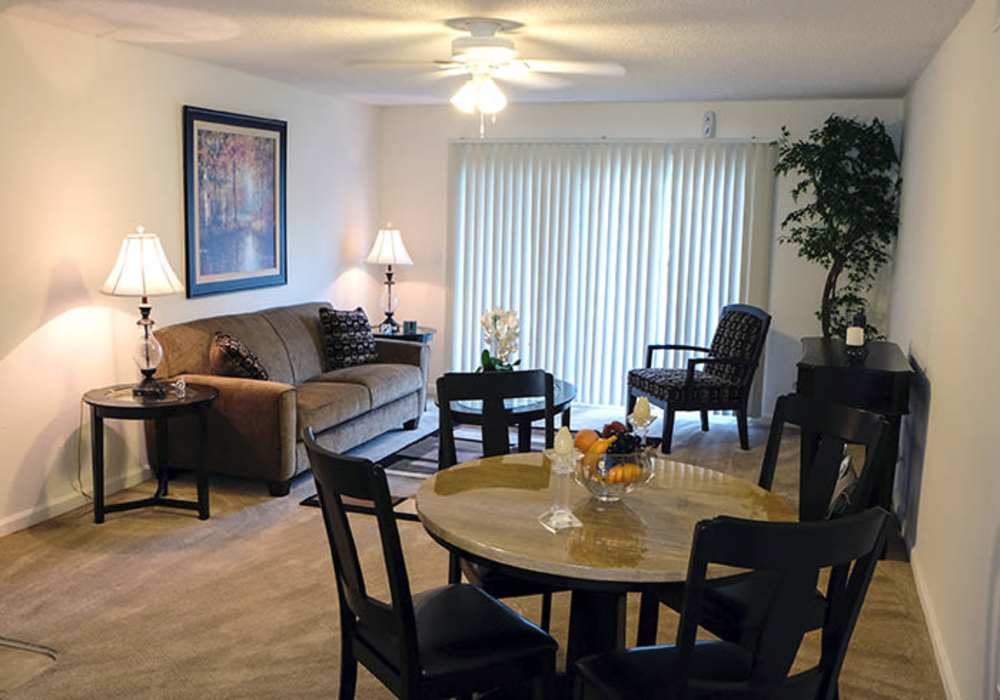 Dining area next to living room at The Hills in San Diego, California