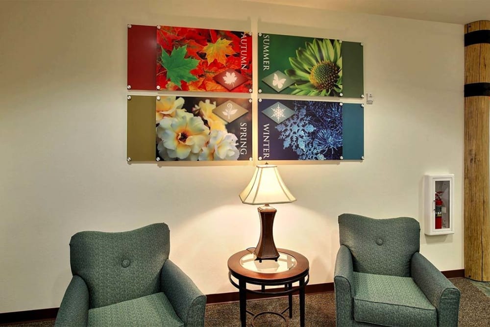Resident reading nook with art work at Milestone Senior Living Woodruff in Woodruff, Wisconsin.
