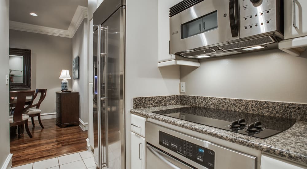 Modern stainless steel appliances at Rienzi at Turtle Creek Apartments in Dallas, Texas