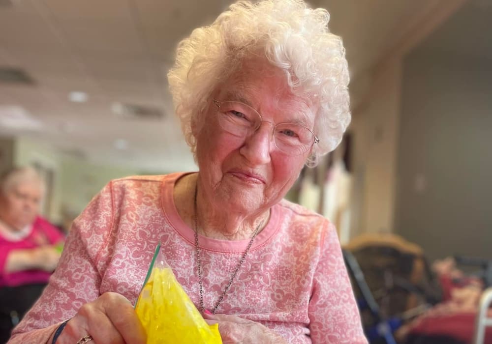 Resident with festive eggs at Bell Tower Residence Assisted Living in Merrill, Wisconsin