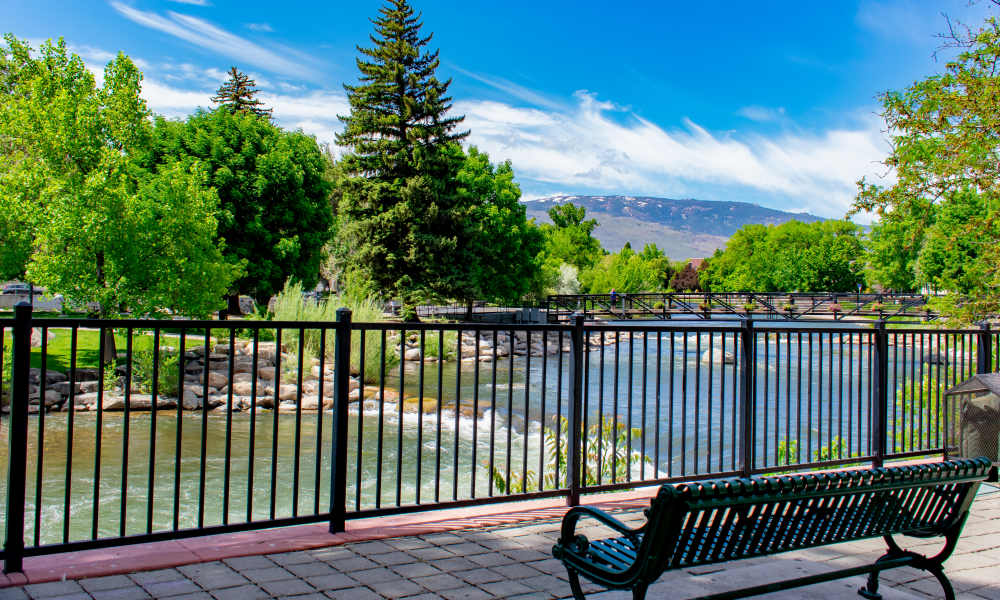 Kitchen with appliances and wood-style flooring at Truckee River Terrace in Reno, Nevada