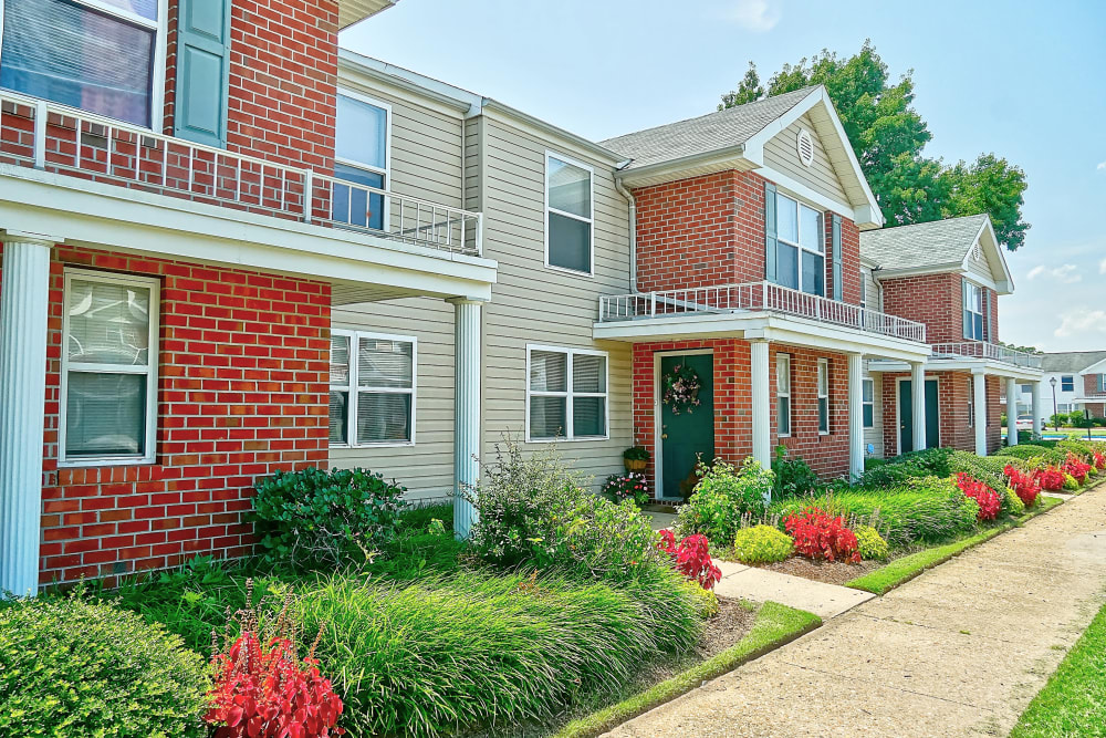 Townhome front side view with meticulous landscaping at Mariner's Watch in Norfolk, Virginia