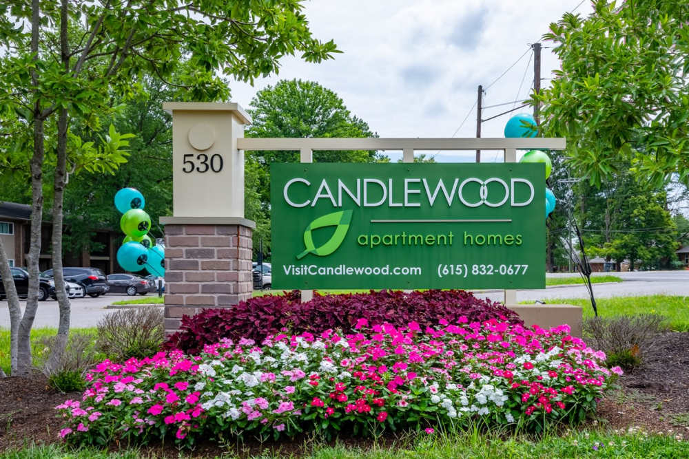 Carpeted bedroom with closet at Candlewood Apartment Homes in Nashville, Tennessee