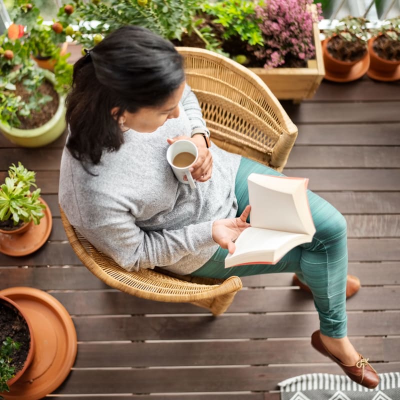 A sits on her private patio at Messenger Place, Manassas, Virginia