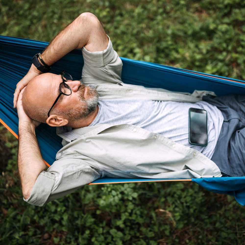 Resident relaxing in the courtyard at Camino Al Oro in Los Angeles, California