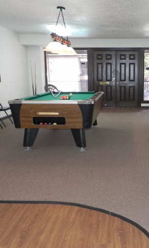 Clubhouse with pool table at Woodland Park in Arlington, Texas