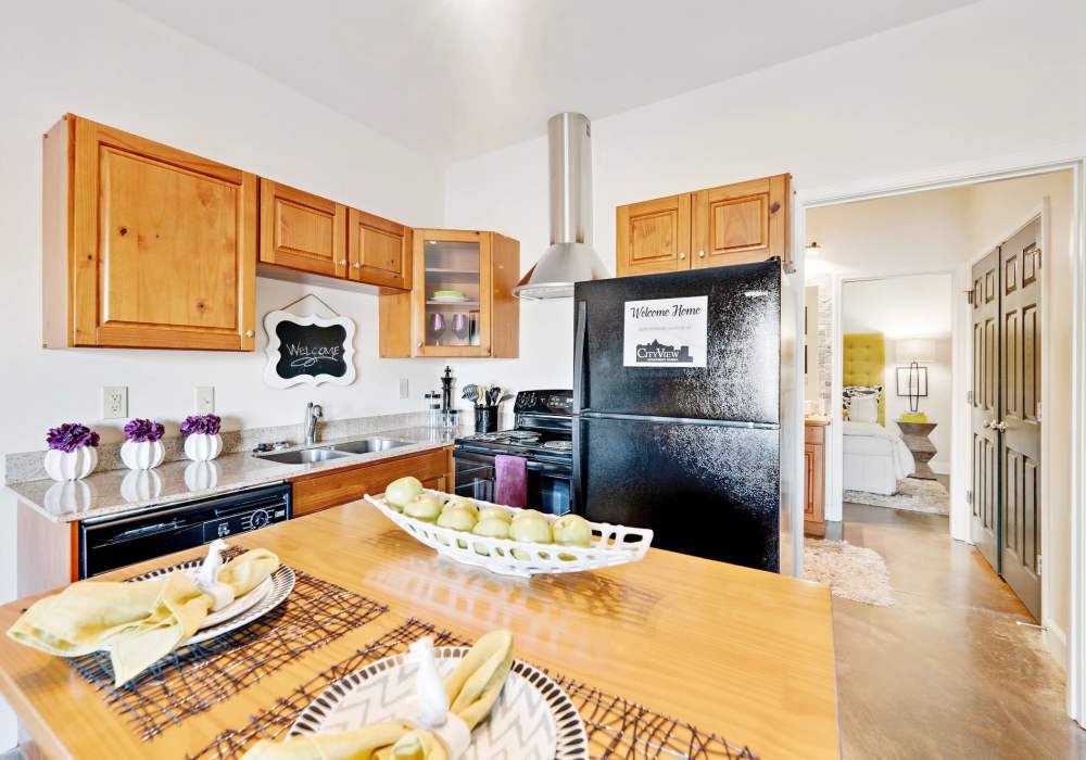 Open layout kitchen and dining area complete with island at CityView Apartments in Greensboro, North Carolina