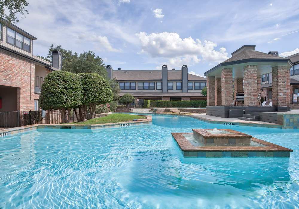 Sparkling swimming pool at Branch Creek Apartments in Carrollton, Texas