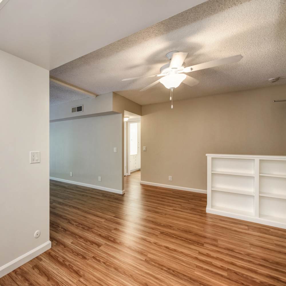 Living space with wood style flooring at Fayette Arms Apartments in Mountain View, California