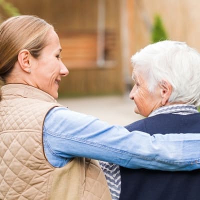 Resident walking with caregiver at The Willows Retirement & Assisted Living in Blackfoot, Idaho