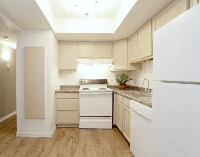 Kitchen with stove, sink and wood cabinets at Andover Park in Valparaiso, Indiana