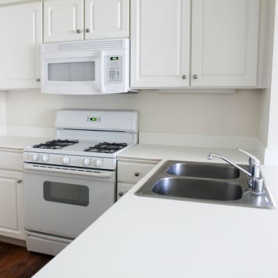 A kitchen with appliances in a home at Canyon View in San Diego, California