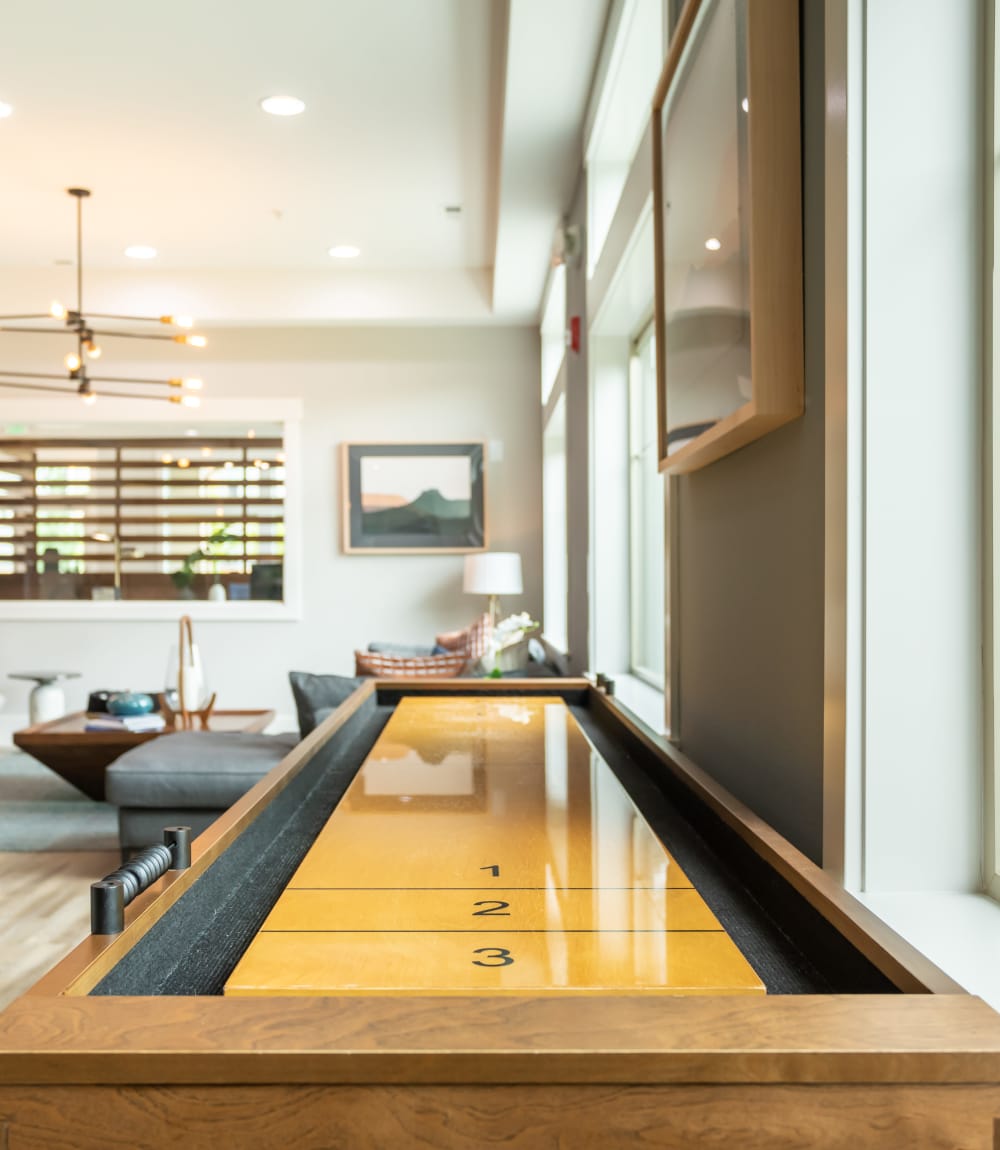 Large shuffleboard table in community lounge at Vue Issaquah in Issaquah, Washington