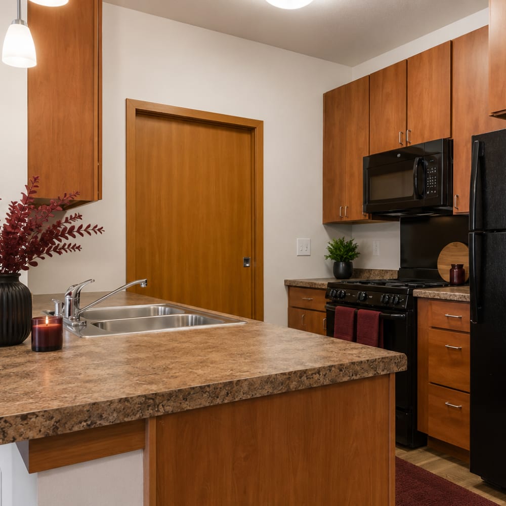 Spacious kitchen with a refrigerator at Cudahy, Wisconsin at Layton Square