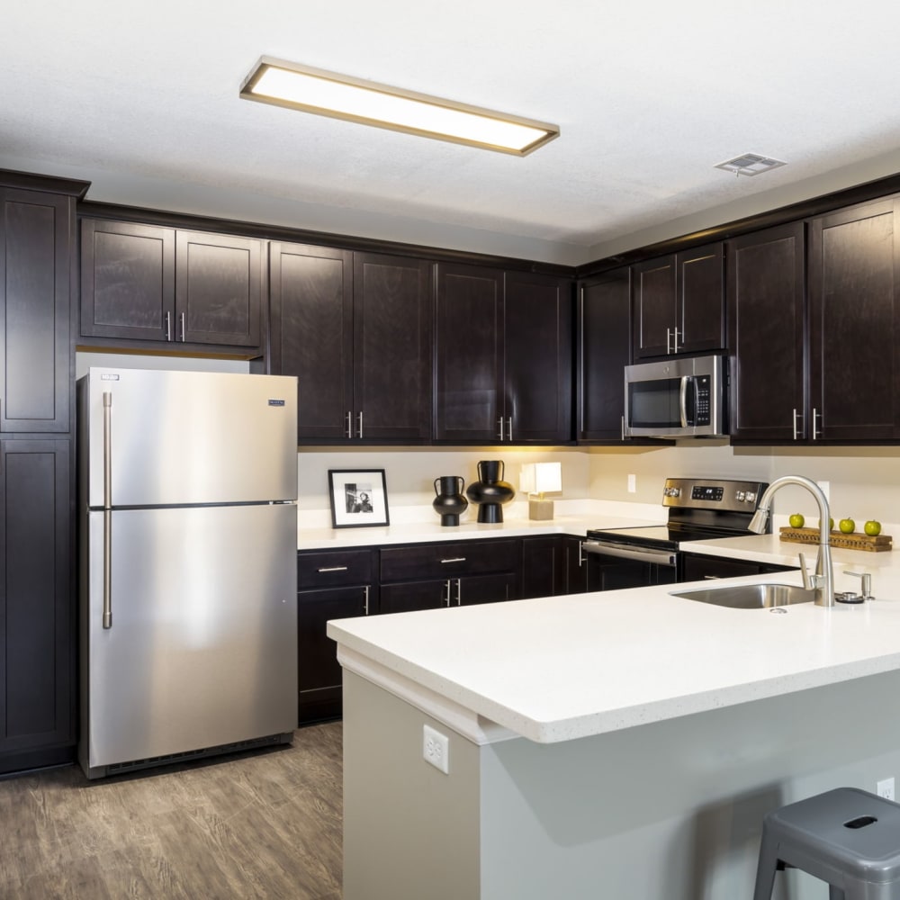 Kitchen updated with new counters and appliances at Springhill Apartments in Overland Park, Kansas